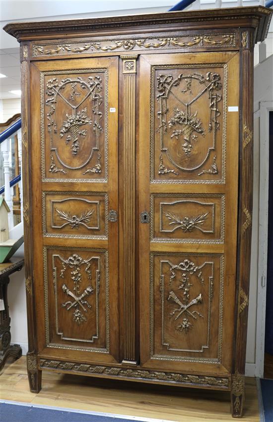 A 19th century French walnut armoire with gilt carving W.150cm.